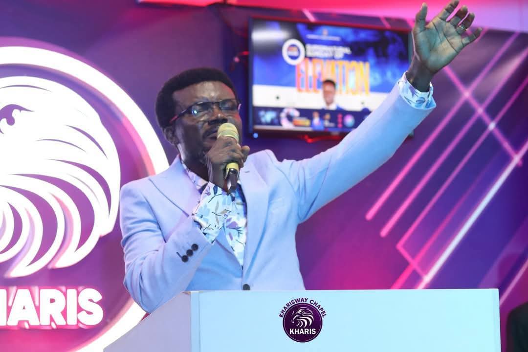 a shot of Dr. Essel infront of the pulpit preaching